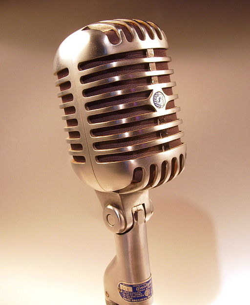 Shure microphone in sepia tone photo via Wiki Media Commons, Holger.Ellgaard